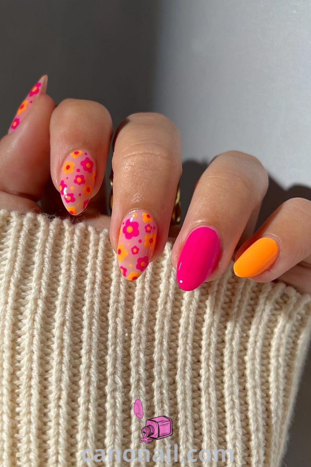 Vibrant spring nails in almond shape with bright colorful designs, gel nail art, boho pink accents, and crazy patterns. Enjoy beautiful nails perfect for the season at canonail.com.