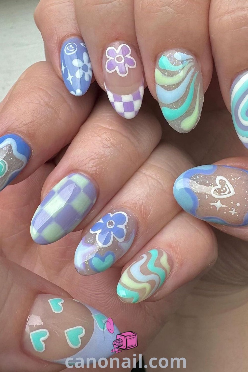 Colorful spring nails on almond nails featuring pastel funky designs, chrome accents, and diverse patterns. A vibrant and fun manicure trend for spring that promotes stylish nail ideas. Discover more stunning nail looks at canonail.com.
