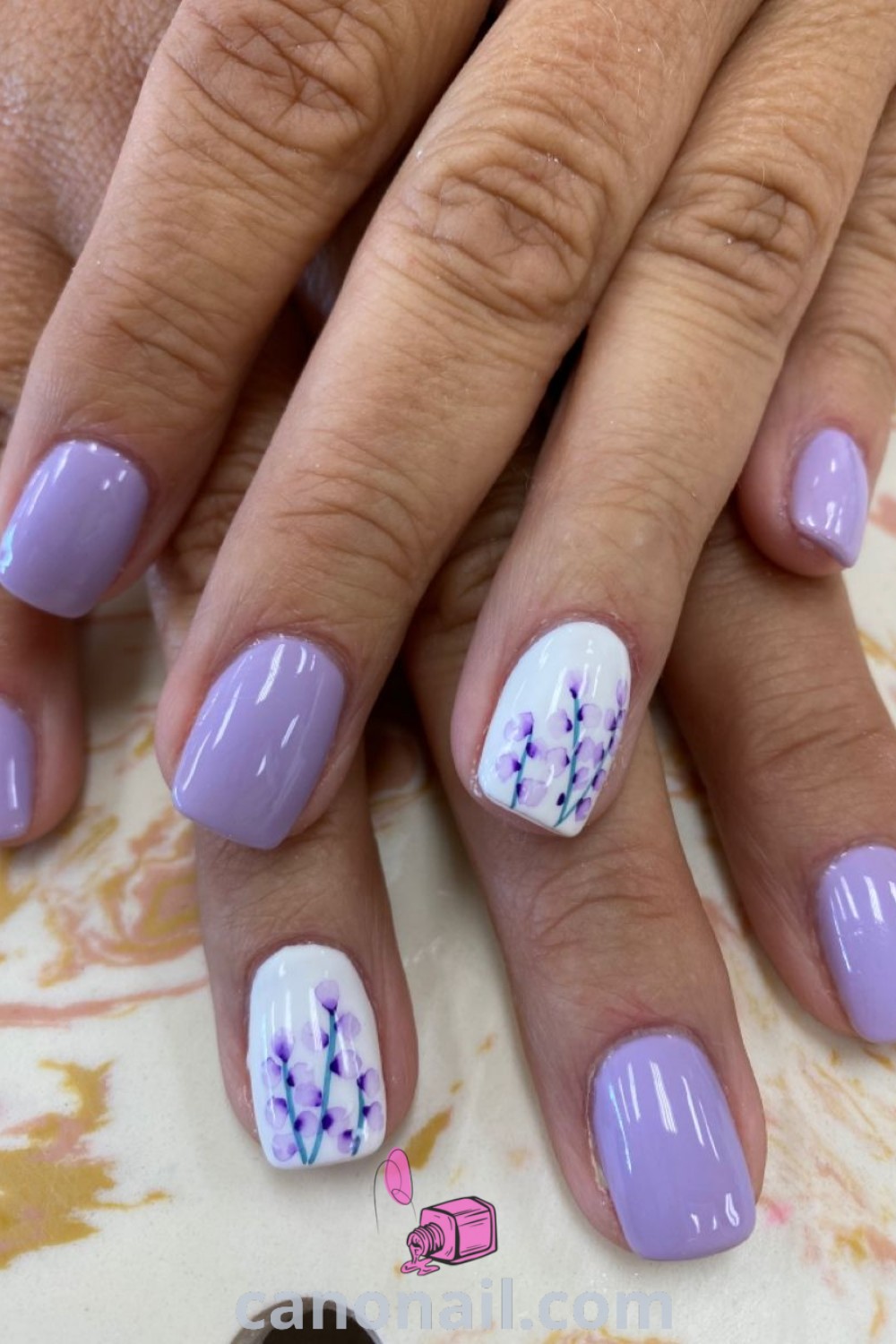Spring nails featuring beautiful gel designs in purple, light purple, and lilac shades, shaped in a square style. An elegant and trendy manicure that emphasizes natural spring themes and stunning nail looks. Discover more at canonail.com.