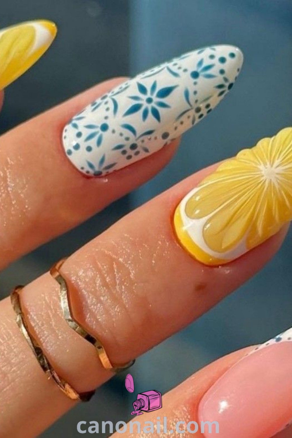 Spring nails in almond shape showcasing Daisy Marshmallow and Lemon nail designs, complemented by hand-painted accents. A stylish and vibrant manicure perfect for spring. Discover more beautiful nails at canonail.com.