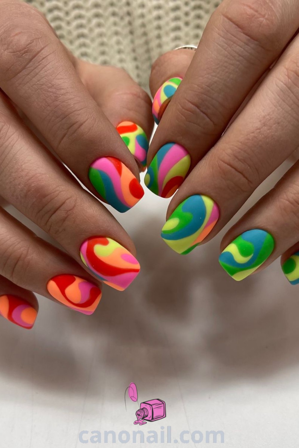 Spring nails featuring almond shape with vibrant colors, aesthetic nail designs, and playful line art. A trendy manicure that showcases beautiful nails and elegant details. Discover more nail inspiration at canonail.com.