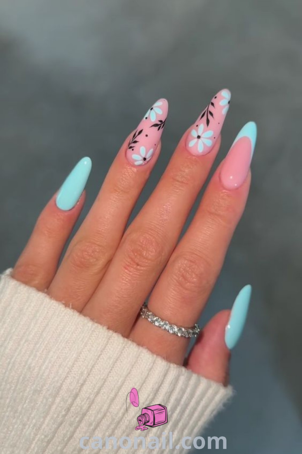 Spring nails designed in almond shape featuring chic acrylic designs with subtle hues and elegant nail art. A beautiful and trendy manicure style for spring showcased at canonail.com.