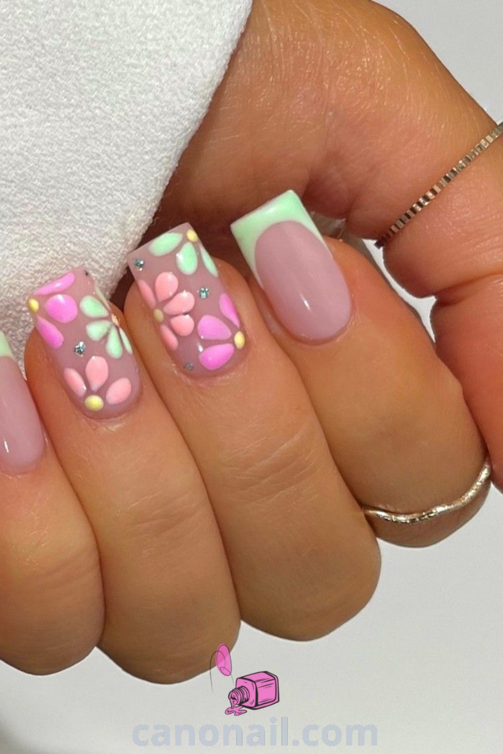 Spring nails on square nails featuring floral designs, pastel shades, and colorful nail tips. A beautiful spring manicure that combines elegance and modern nail designs. Discover more nail ideas at canonail.com.