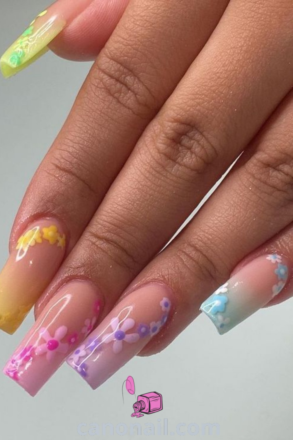 Spring nails featuring square designs with daisy patterns and vibrant colors, perfect for short nail sets. Explore beautiful floral nail ideas and trendy manicure styles at canonail.com.