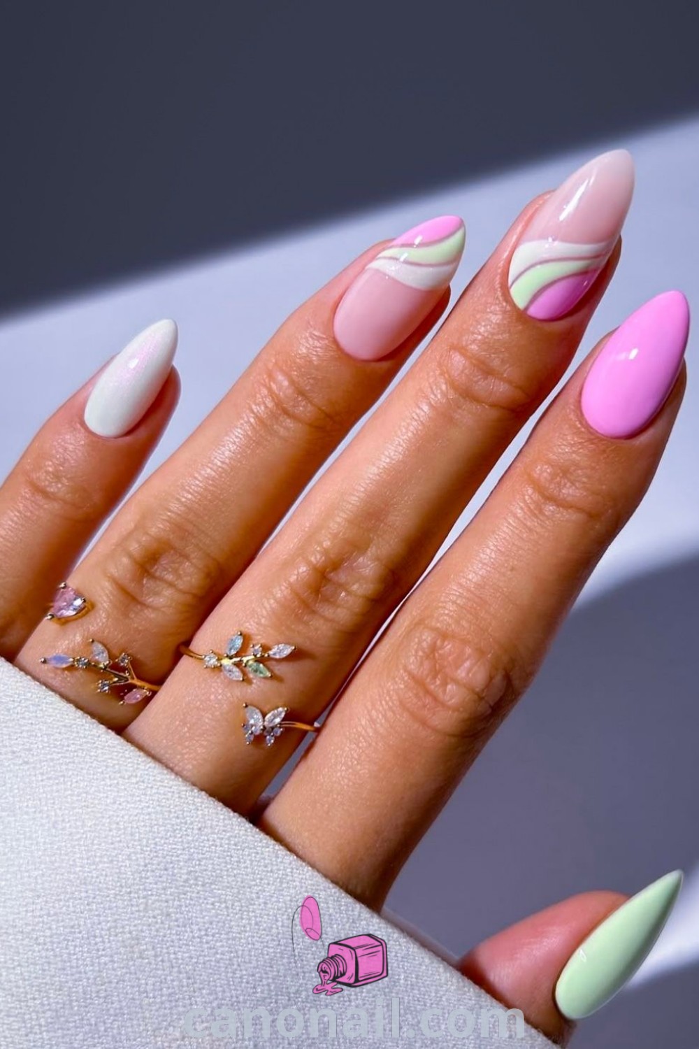 Spring nails with vibrant almond-shaped designs showcasing bright colors and sherbet styles, including simple spring break nail art. Perfect for fresh nail inspiration, explore modern nail designs at canonail.com.