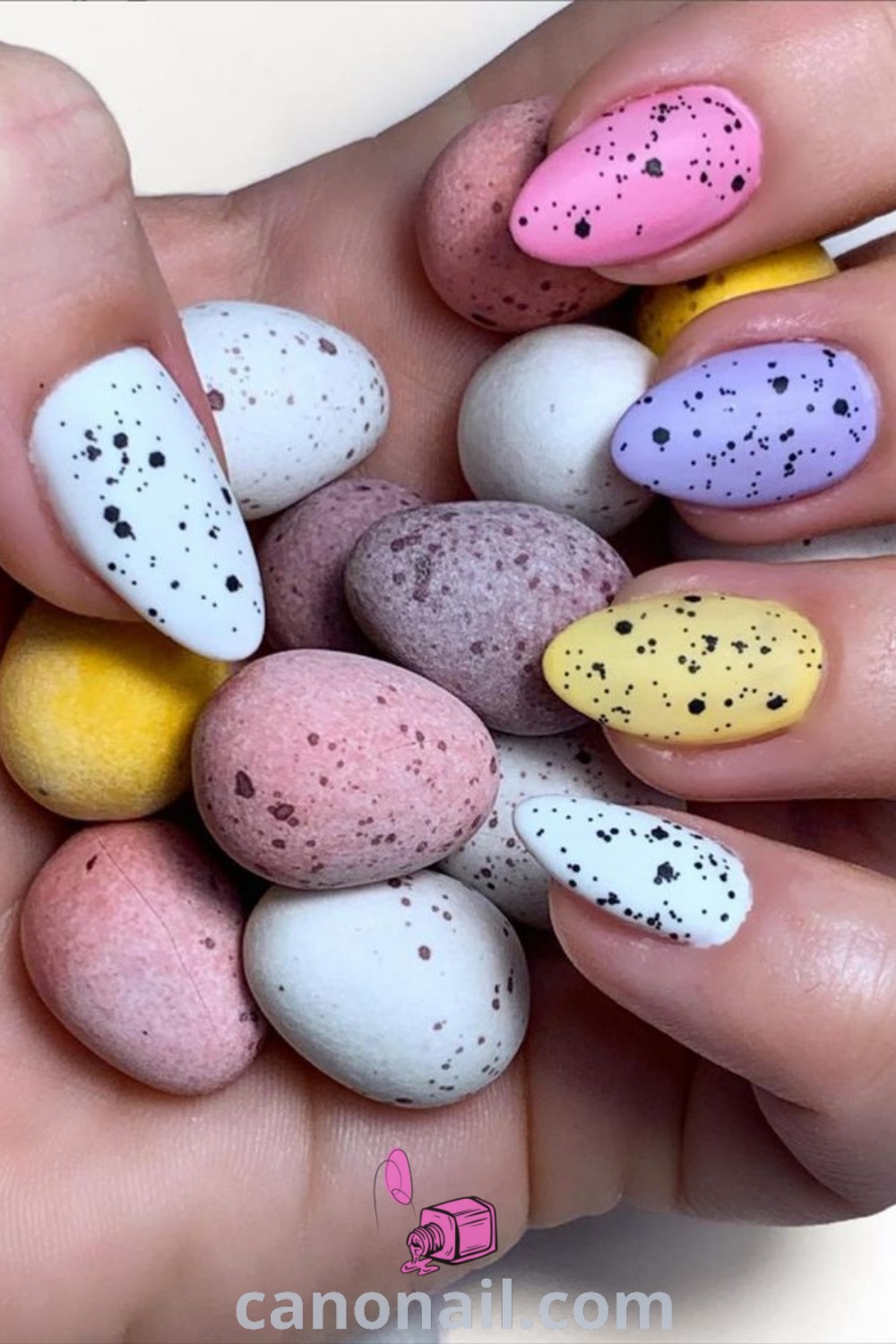 Spring nails in coral on almond-shaped nails showcasing bright nail colors, modern nail designs, and fairy-inspired details. A vibrant and elegant manicure perfectly capturing the essence of spring. Discover more nail inspiration at canonail.com.