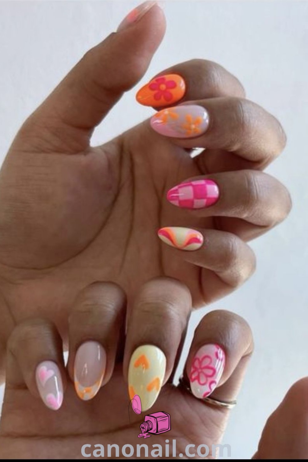 Spring nails on almond-shaped nails featuring vibrant summer flower acrylic designs, funky nail art, and cute simple styles. A stunning and trendy manicure perfect for the season. Discover more nail ideas at canonail.com.
