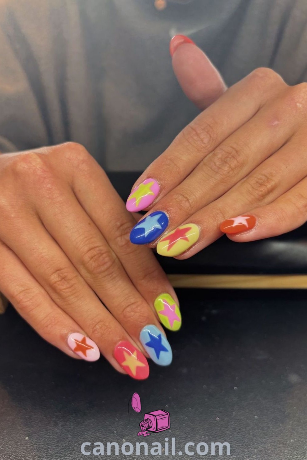 Spring nails featuring colorful designs in blue, yellow, and red on almond-shaped nails. Explore bright cruise nails and funky acrylic styles for a modern look. Get inspired by these beautiful nails and nail art at canonail.com.