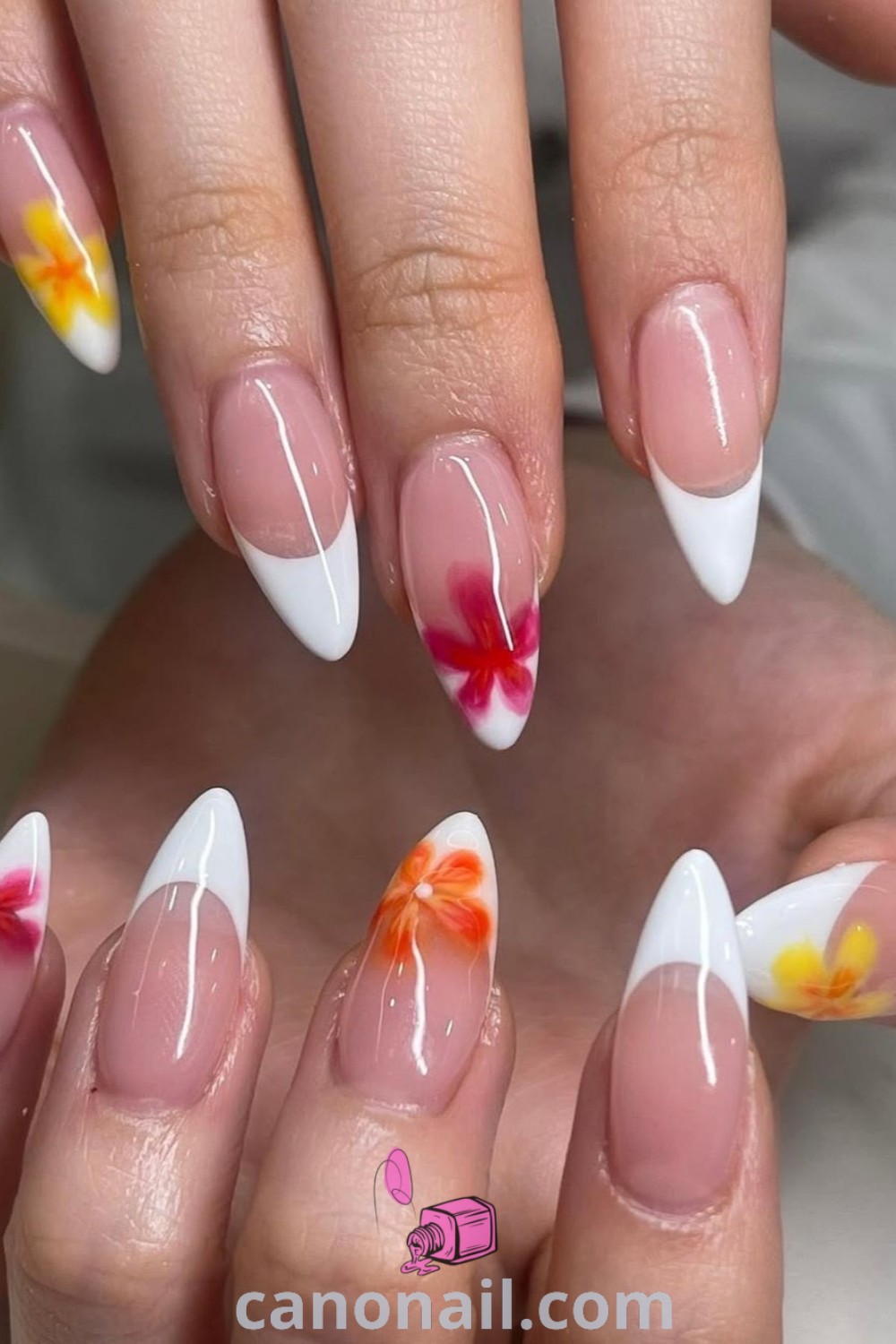 Spring nails in a bright baby orange hue with blooming gel designs on almond nails. This elegant nail art showcases easy spring designs and beach-inspired aesthetics. Explore more beautiful nail ideas at canonail.com.