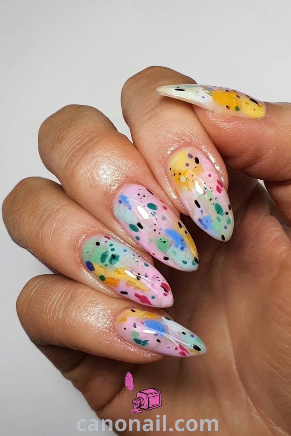 Spring nails with trendy almond shapes featuring watercolor art, abstract designs, and colorful patterns for a stunning and elegant manicure. Discover more nail art inspiration at canonail.com.