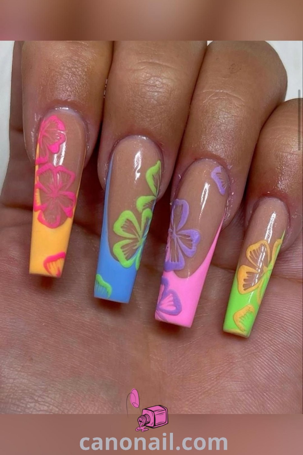Spring nails featuring square shapes with Hawaiian flower designs and neon colors, perfect for trendy manicures. This elegant nail art beautifully captures the essence of spring. Discover more stunning nail ideas at canonail.com.