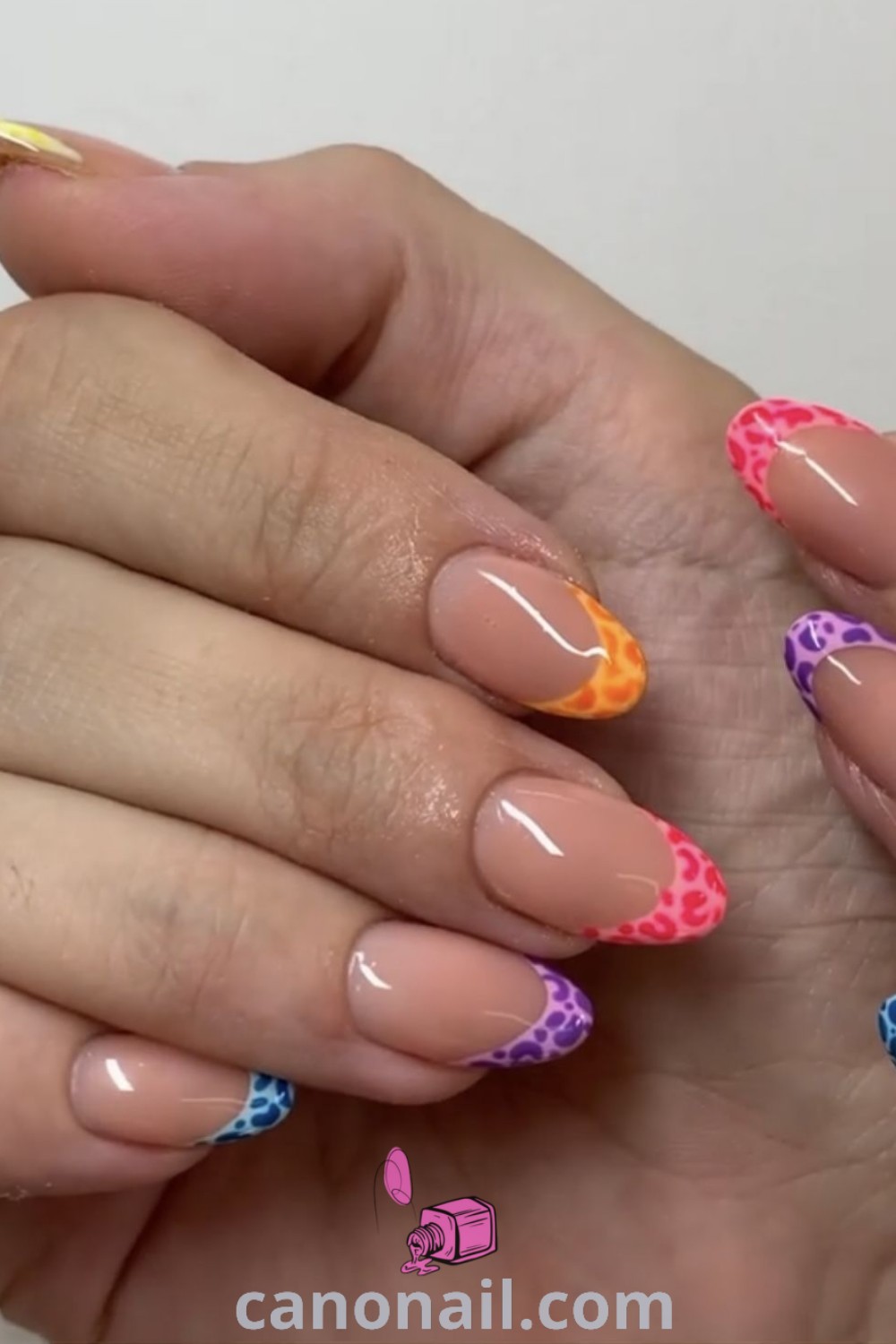 Colorful spring nails on almond-shaped nails featuring vibrant designs, fun patterns like colorful leopards, and cute summer vacation themes. A stylish and cheerful nail inspiration, explore more modern nail ideas at canonail.com.