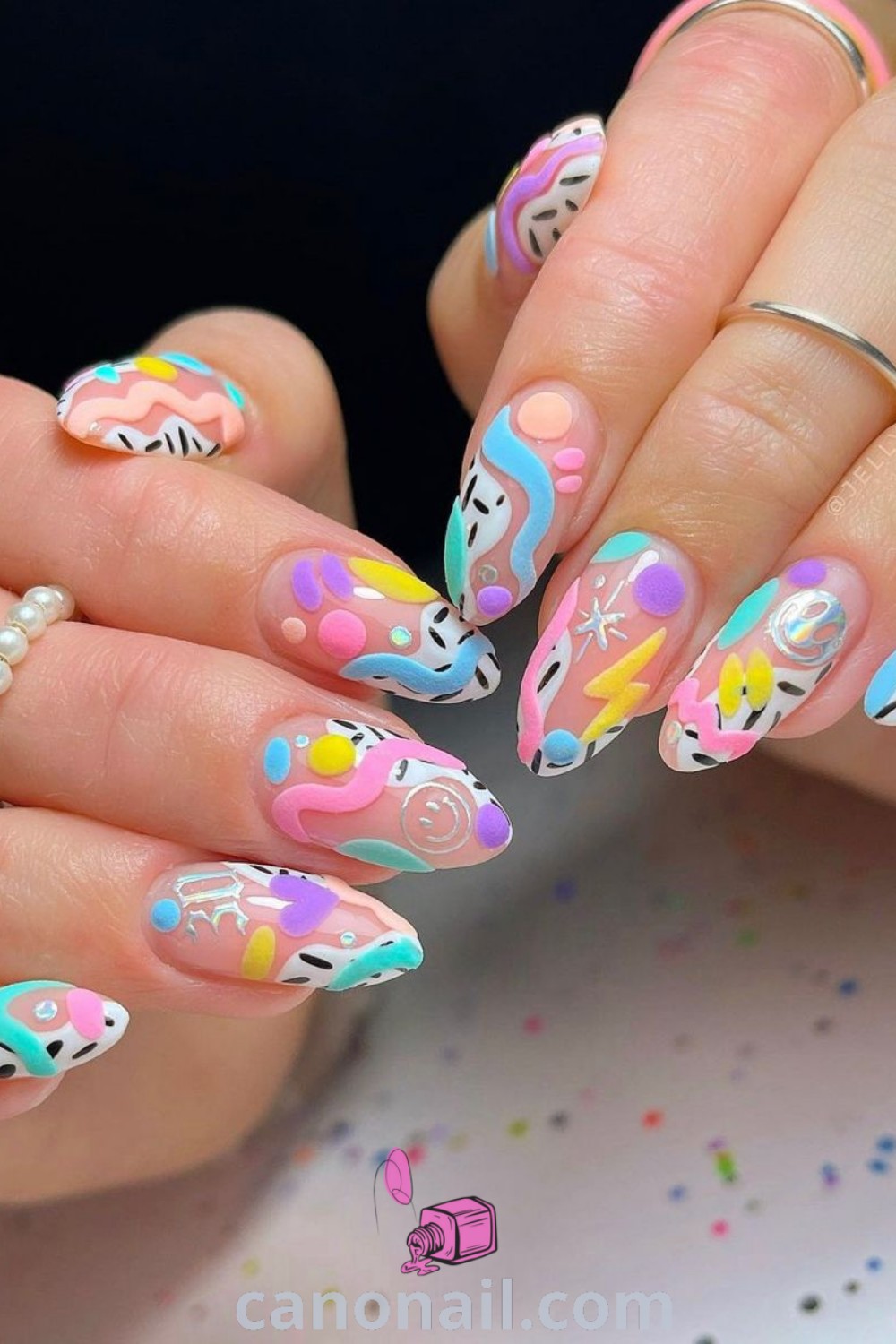 Spring nails on almond-shaped nails featuring colorful designs, tropical themes, and funky art. This collection offers unique nail inspiration for a trendy manicure that captures the essence of spring. Discover beautiful nail ideas at canonail.com.