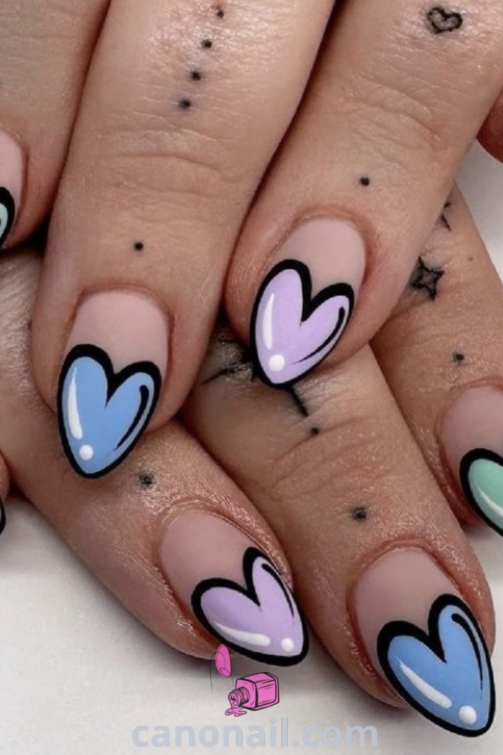 Spring nails on almond-shaped nails showcasing pop art, valentine nail art, and colorful designs that embody the season