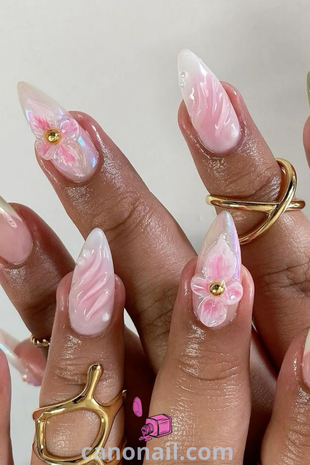 Spring nails for almond shape featuring pink and green hues, 3D designs, and abstract patterns. Discover stunning nail looks and inspiration for modern manicures at canonail.com.